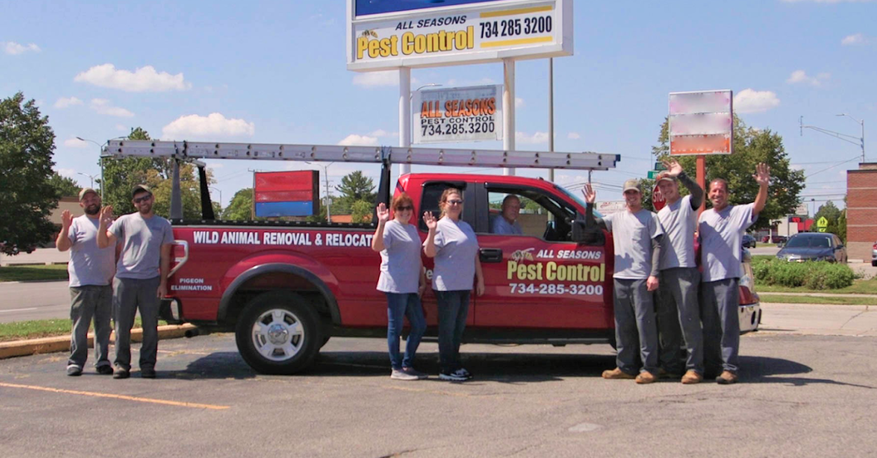 all seasons pest control workers with truck