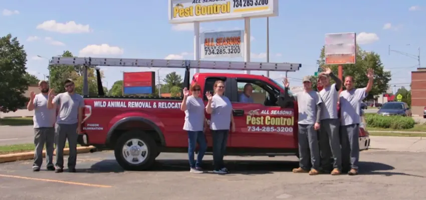 all seasons pest control workers with truck